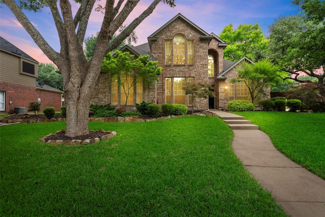 1 Parkside Cir, Allen, TX 75013 - traditional-style house featuring brick siding, a front lawn, and central air condition unit