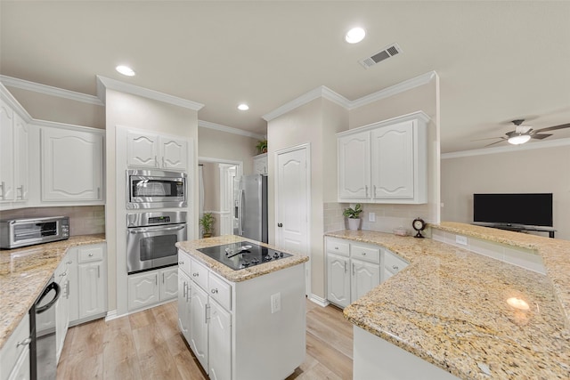 1 Parkside Cir, Allen, TX 75013 - kitchen featuring appliances with stainless steel finishes, light wood finished floors, white cabinets, backsplash, and recessed lighting