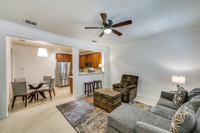 3005 Stone Forest Cir, Mckinney, TX 75070 - living area with crown molding, a ceiling fan, light colored carpet, and baseboards