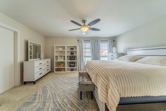 5806 Birchbrook Dr Unit 203, Dallas, TX 75206 - bedroom featuring light colored carpet and a ceiling fan