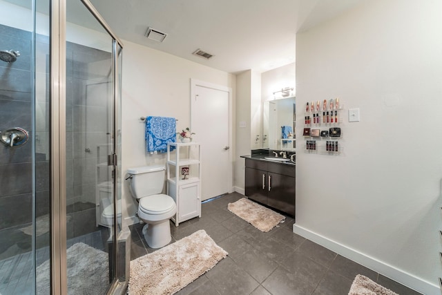 5806 Birchbrook Dr Unit 203, Dallas, TX 75206 - bathroom featuring vanity, a stall shower, tile patterned floors, toilet, and baseboards
