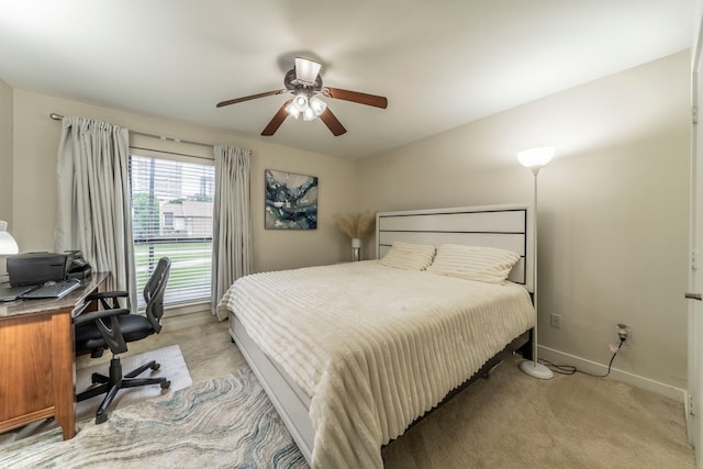 5806 Birchbrook Dr Unit 203, Dallas, TX 75206 - bedroom featuring light carpet, a desk, baseboards, and ceiling fan