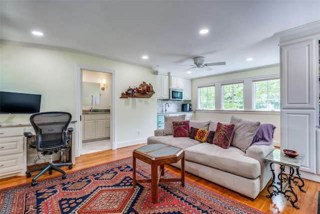 533 Newell Ave, Dallas, TX 75223 - living area with crown molding, a desk, a ceiling fan, recessed lighting, and light wood-style flooring