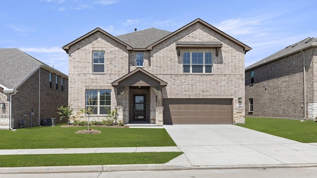 9305 Derry Ln, Aubrey, TX 76227 - view of front facade with brick siding, a garage, and a front lawn