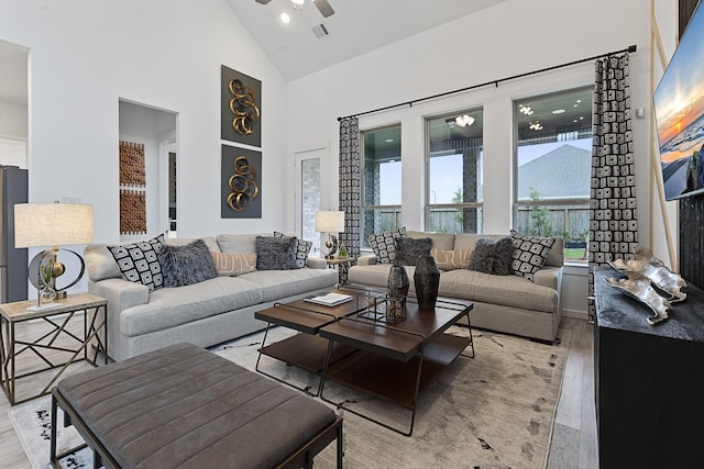 9305 Derry Ln, Aubrey, TX 76227 - living room with light wood-style floors, high vaulted ceiling, and ceiling fan