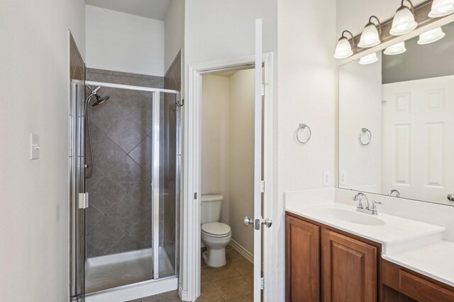 1280 Seymour Dr, Frisco, TX 75034 - full bathroom featuring vanity, toilet, a shower stall, and tile patterned flooring