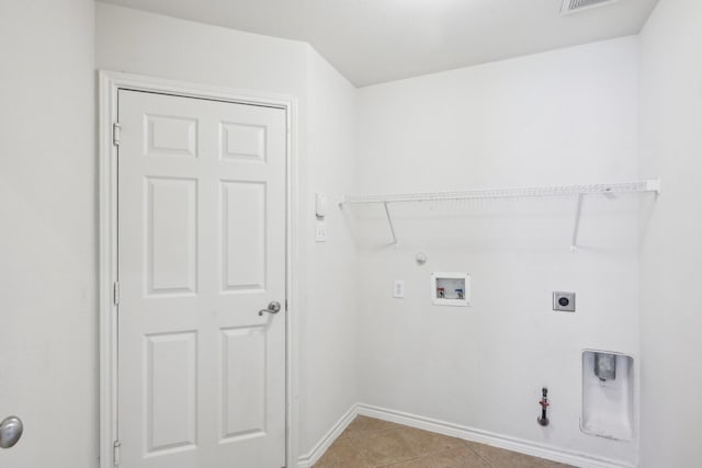 1280 Seymour Dr, Frisco, TX 75034 - laundry area featuring gas dryer hookup, hookup for an electric dryer, washer hookup, and light tile patterned floors