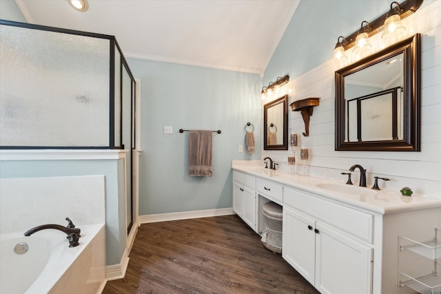 1300 Darbyton Dr, Hewitt, TX 76643 - bathroom featuring a stall shower, a bath, double vanity, wood finished floors, and lofted ceiling