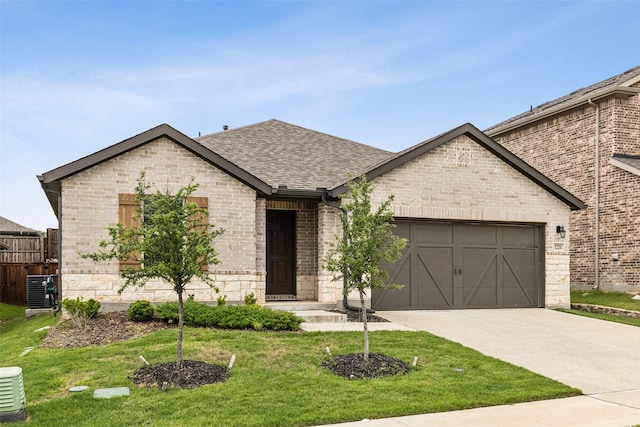 1224 Johnson Dr, Celina, TX 75009 - french country home featuring an attached garage, driveway, roof with shingles, brick siding, and cooling unit