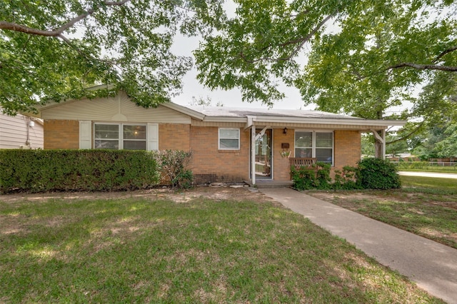 2002 Winthrop St, Irving, TX 75061 - ranch-style home with brick siding, a front yard, and a porch