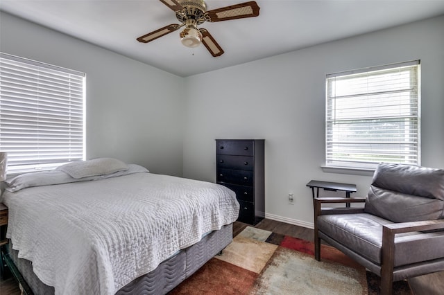 2002 Winthrop St, Irving, TX 75061 - bedroom featuring wood finished floors, ceiling fan, and baseboards