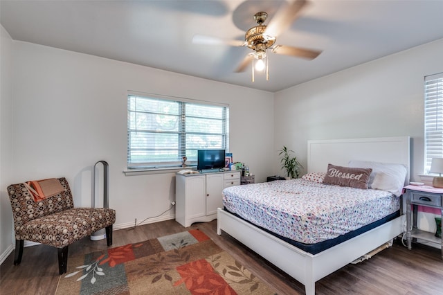 2002 Winthrop St, Irving, TX 75061 - bedroom with wood finished floors, a ceiling fan, and baseboards