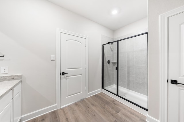 340 Live Oak Ln, Hutchins, TX 75141 - bathroom featuring wood finished floors, a stall shower, vanity, and baseboards
