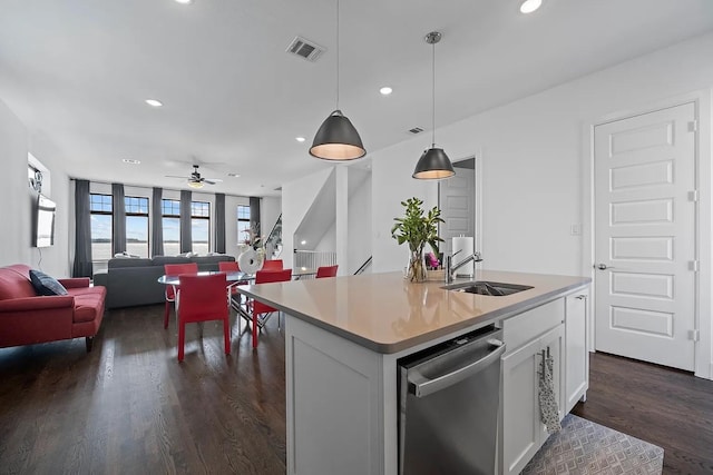 516 Secretariat Dr, Rowlett, TX 75088 - kitchen with dishwasher, white cabinets, dark wood finished floors, open floor plan, and light countertops