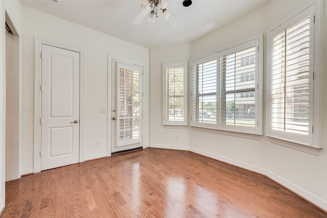 1400 Clarinet Ln, Plano, TX 75074 - spare room featuring light wood finished floors, a ceiling fan, and baseboards
