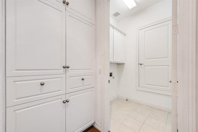1400 Clarinet Ln, Plano, TX 75074 - laundry area featuring cabinet space, electric dryer hookup, and baseboards