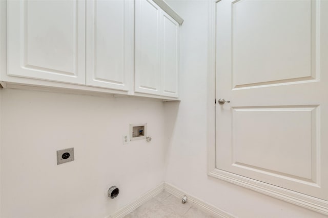 1400 Clarinet Ln, Plano, TX 75074 - laundry room with hookup for an electric dryer, washer hookup, hookup for a gas dryer, baseboards, and cabinet space