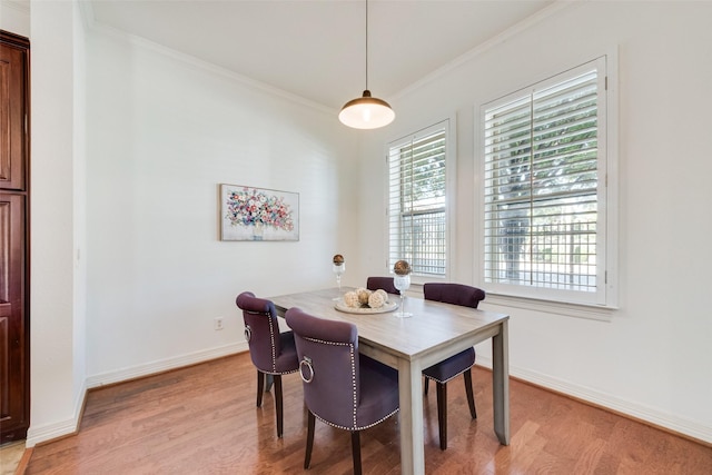 1400 Clarinet Ln, Plano, TX 75074 - dining area featuring light wood-style flooring, ornamental molding, and baseboards