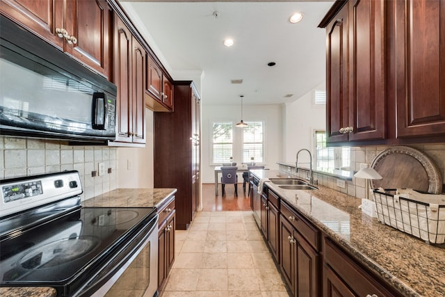 1400 Clarinet Ln, Plano, TX 75074 - kitchen featuring stainless steel electric stove, black microwave, a sink, dark stone counters, and decorative backsplash