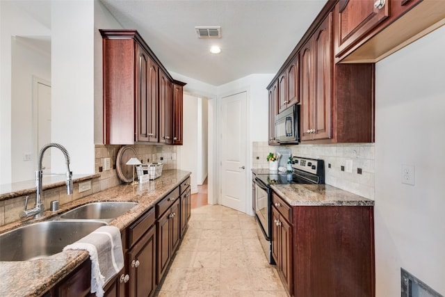 1400 Clarinet Ln, Plano, TX 75074 - kitchen featuring electric range oven, black microwave, a sink, and light stone countertops