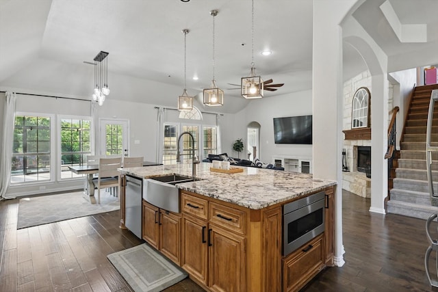 163 Las Colinas Trl, Cross Roads, TX 76227 - kitchen featuring appliances with stainless steel finishes, a sink, vaulted ceiling, ceiling fan, and dark wood finished floors