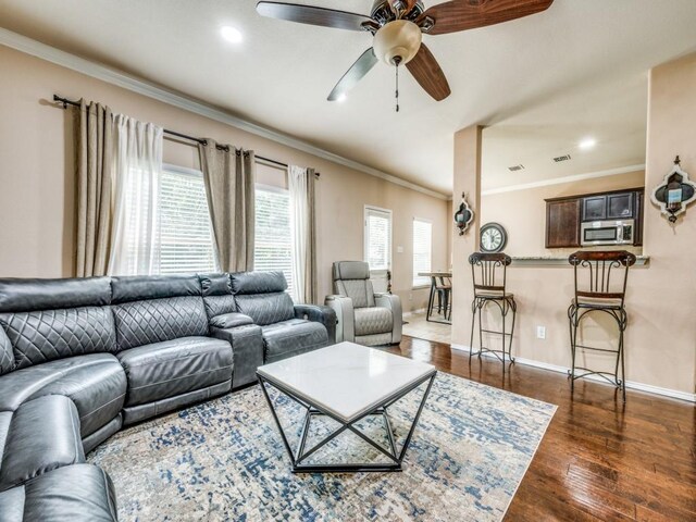 8924 Holliday Ln, Aubrey, TX 76227 - living room featuring crown molding, a ceiling fan, dark wood-style floors, baseboards, and recessed lighting