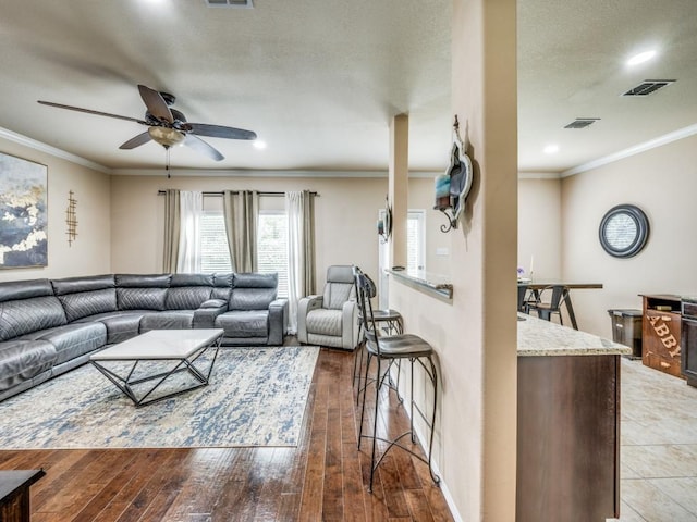 8924 Holliday Ln, Aubrey, TX 76227 - living area with ceiling fan, ornamental molding, hardwood / wood-style floors, and recessed lighting