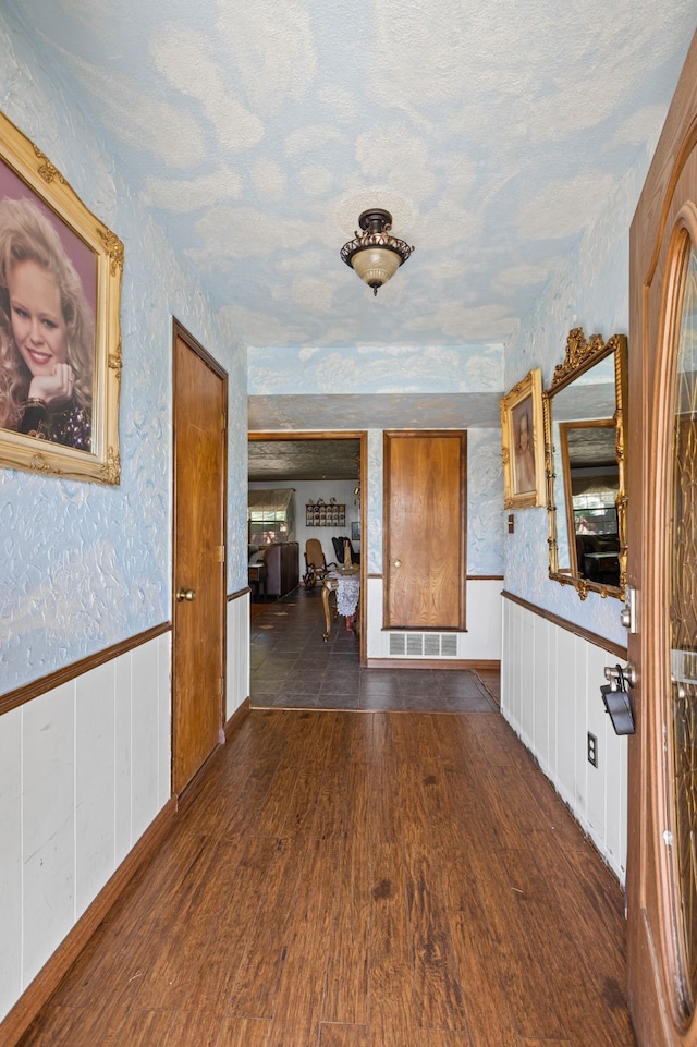 100 Yorkshire Dr, Princeton, TX 75407 - corridor featuring wainscoting and dark wood-type flooring
