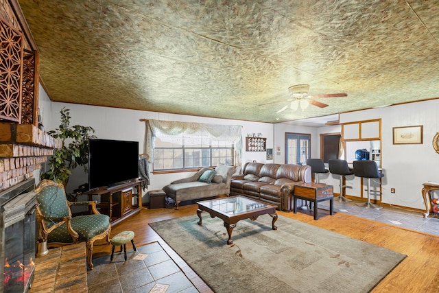 100 Yorkshire Dr, Princeton, TX 75407 - living area featuring a ceiling fan, plenty of natural light, and a fireplace