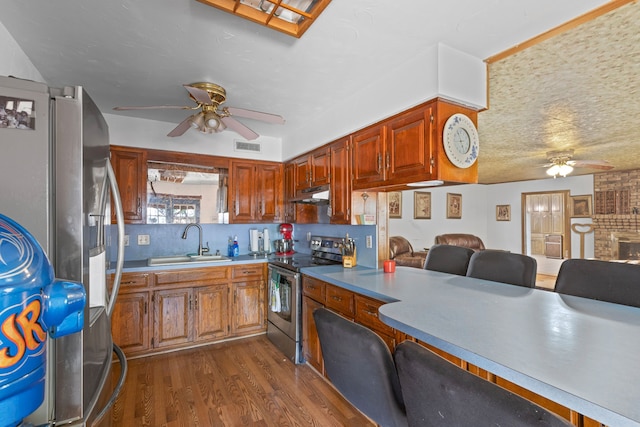 100 Yorkshire Dr, Princeton, TX 75407 - kitchen with appliances with stainless steel finishes, a ceiling fan, a sink, and under cabinet range hood