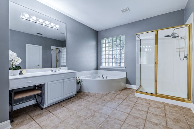 8905 Glen Garden Dr, Mckinney, TX 75072 - bathroom with a shower stall, vanity, a bath, and tile patterned floors