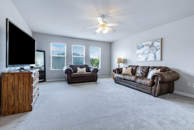 8905 Glen Garden Dr, Mckinney, TX 75072 - living area featuring light carpet, ceiling fan, and baseboards