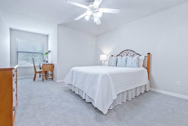 8905 Glen Garden Dr, Mckinney, TX 75072 - bedroom with light carpet, baseboards, and ceiling fan
