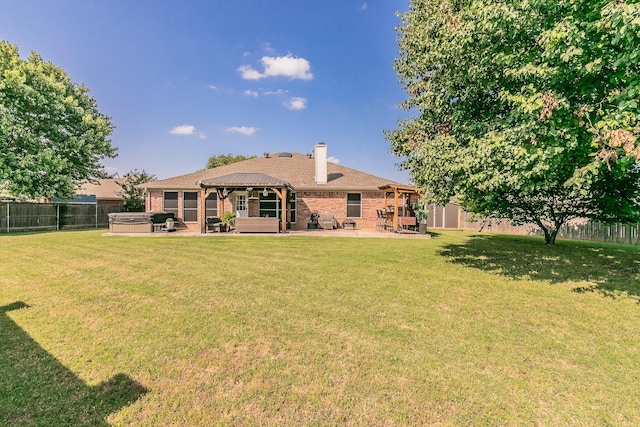 4408 Ashbury Ln, Mansfield, TX 76063 - rear view of property with a hot tub, a gazebo, a patio area, brick siding, and a chimney