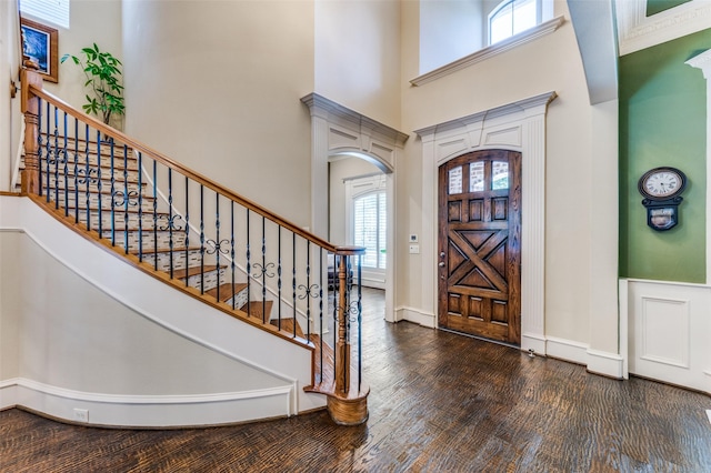 2458 W Creek Dr, Frisco, TX 75033 - entryway with a high ceiling, wood finished floors, arched walkways, baseboards, and stairway