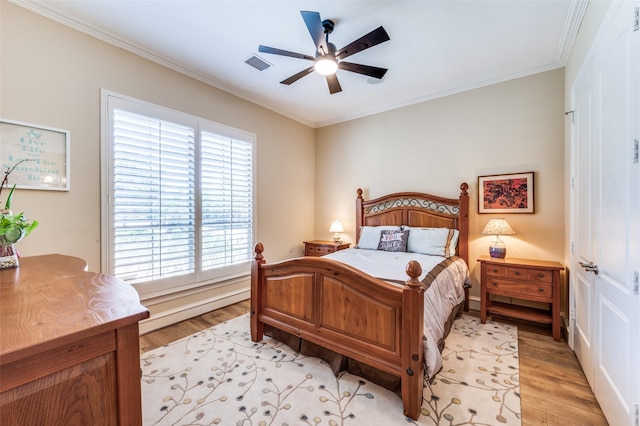2458 W Creek Dr, Frisco, TX 75033 - bedroom featuring light wood finished floors, crown molding, ceiling fan, and baseboards