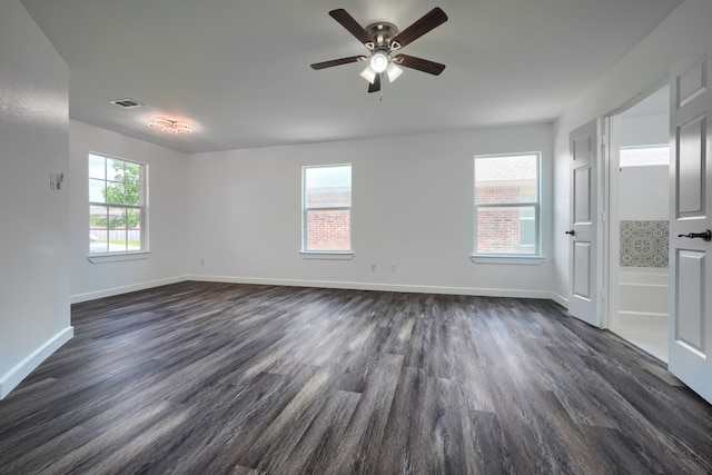 1722 Harvest Crossing Dr, Wylie, TX 75098 - empty room with dark wood finished floors, plenty of natural light, and baseboards