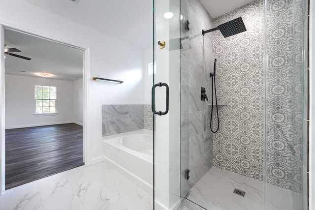 1722 Harvest Crossing Dr, Wylie, TX 75098 - full bath with a garden tub, a stall shower, baseboards, marble finish flooring, and a ceiling fan