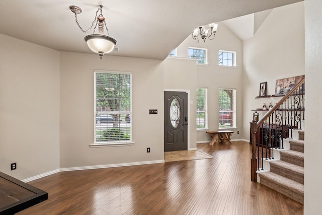 5308 Timber Park Dr, Flower Mound, TX 75028 - entryway featuring stairway, a chandelier, wood finished floors, and baseboards