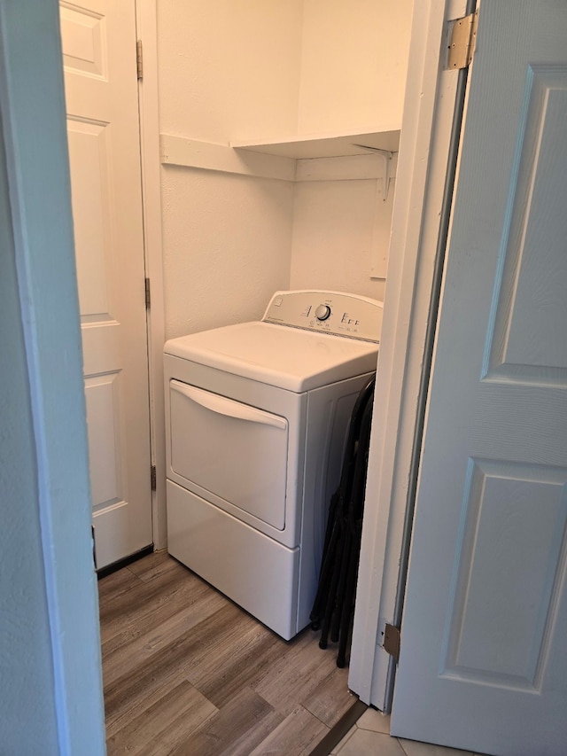 220 Bluebird Cir, Denton, TX 76209 - washroom featuring washer / clothes dryer and light wood-type flooring