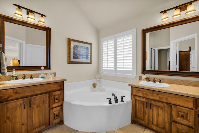 7100 King Ranch Rd, North Richland Hills, TX 76182 - bathroom with two vanities, vaulted ceiling, a whirlpool tub, and tile patterned flooring