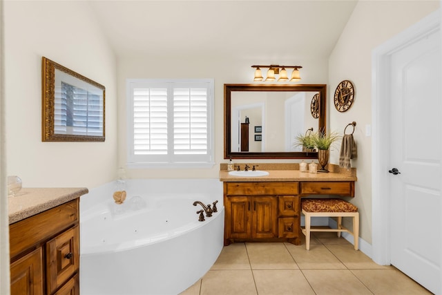7100 King Ranch Rd, North Richland Hills, TX 76182 - bathroom with vanity, a jetted tub, and tile patterned flooring