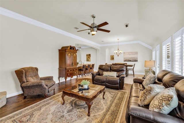 7100 King Ranch Rd, North Richland Hills, TX 76182 - living room with wood finished floors, arched walkways, a ceiling fan, a chandelier, and baseboards