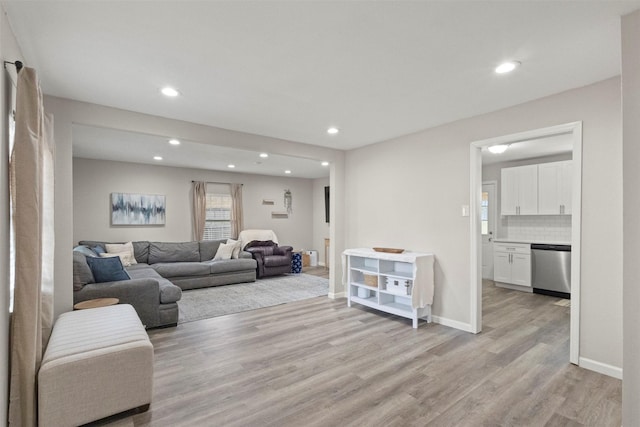 1503 Dale Dr, Arlington, TX 76010 - living area featuring light wood-style floors, recessed lighting, and baseboards