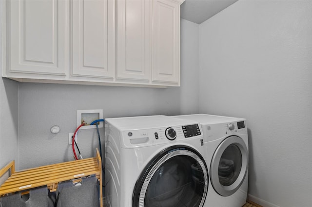 103 Daisey Ln, Justin, TX 76247 - laundry room with separate washer and dryer, cabinet space, and baseboards