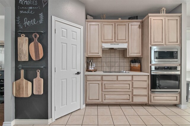 103 Daisey Ln, Justin, TX 76247 - kitchen with appliances with stainless steel finishes, light brown cabinets, under cabinet range hood, decorative backsplash, and light countertops