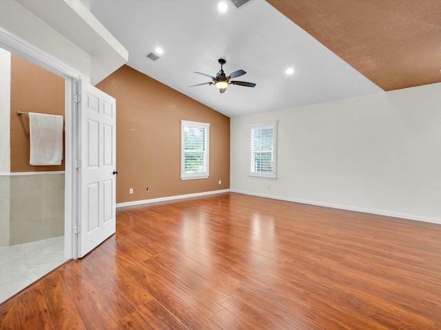 710 Crows Pt, Lake Bridgeport, TX 76426 - empty room with ceiling fan, wood finished floors, vaulted ceiling, baseboards, and recessed lighting