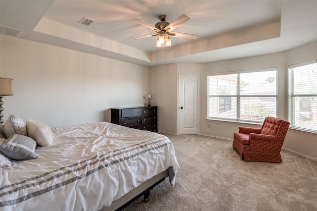 1531 Winding Trail Dr, Allen, TX 75002 - carpeted bedroom featuring a tray ceiling, baseboards, and a ceiling fan