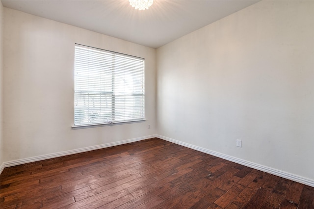 1531 Winding Trail Dr, Allen, TX 75002 - unfurnished room featuring dark wood-style flooring and a chandelier
