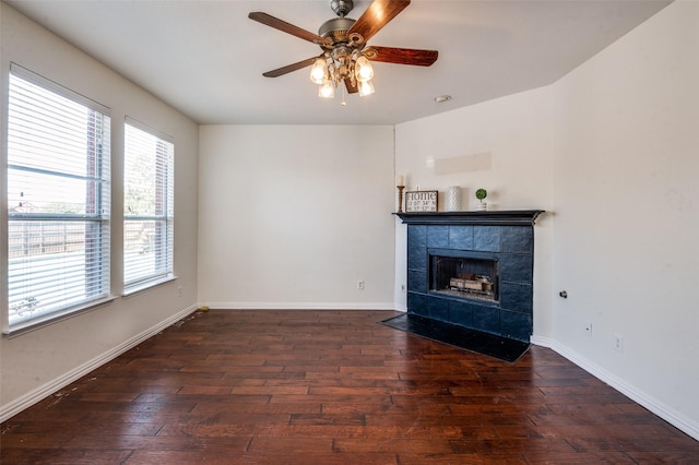1531 Winding Trail Dr, Allen, TX 75002 - unfurnished living room featuring wood-type flooring, a ceiling fan, a tile fireplace, and baseboards
